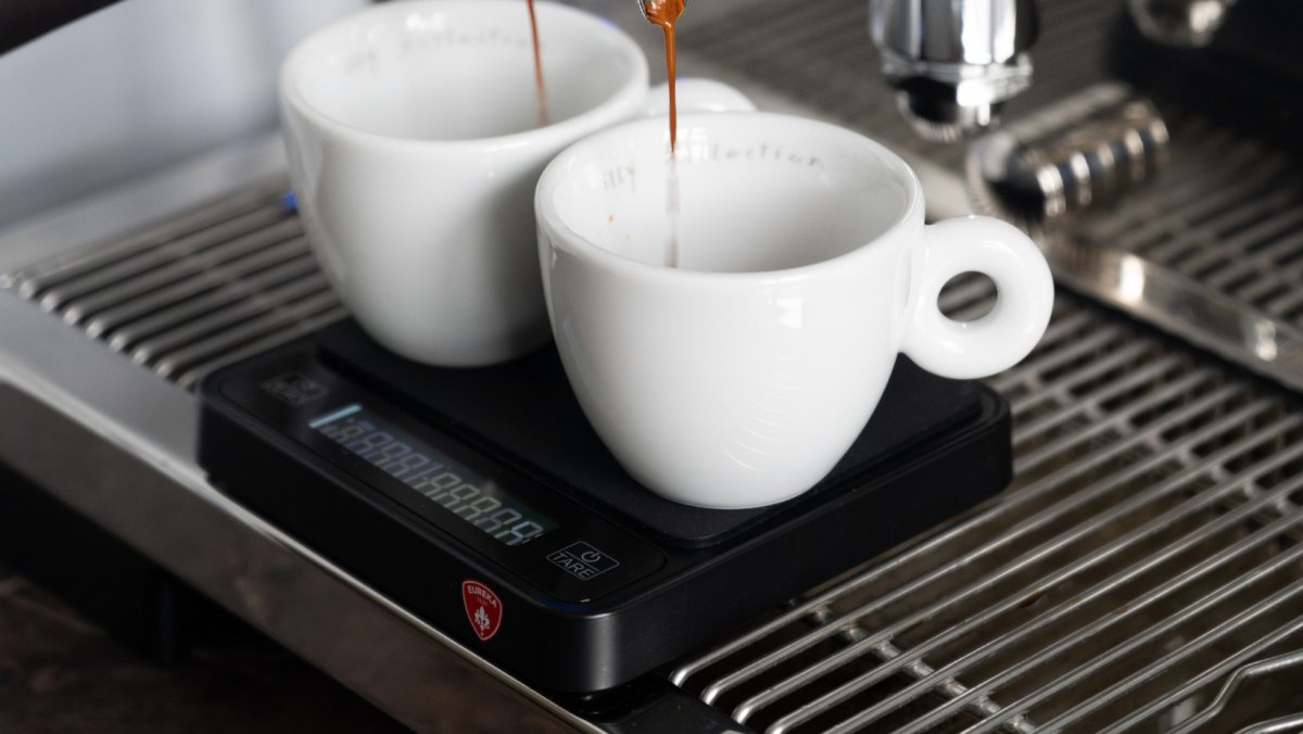 Two espresso cups on the Eureka Precisa scale under the espresso machine